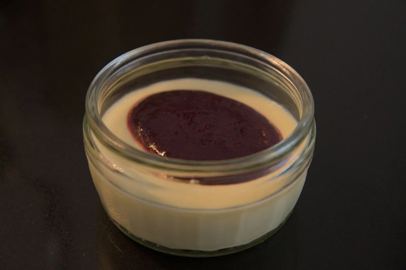 Lemon posset with blueberry and pine sauce