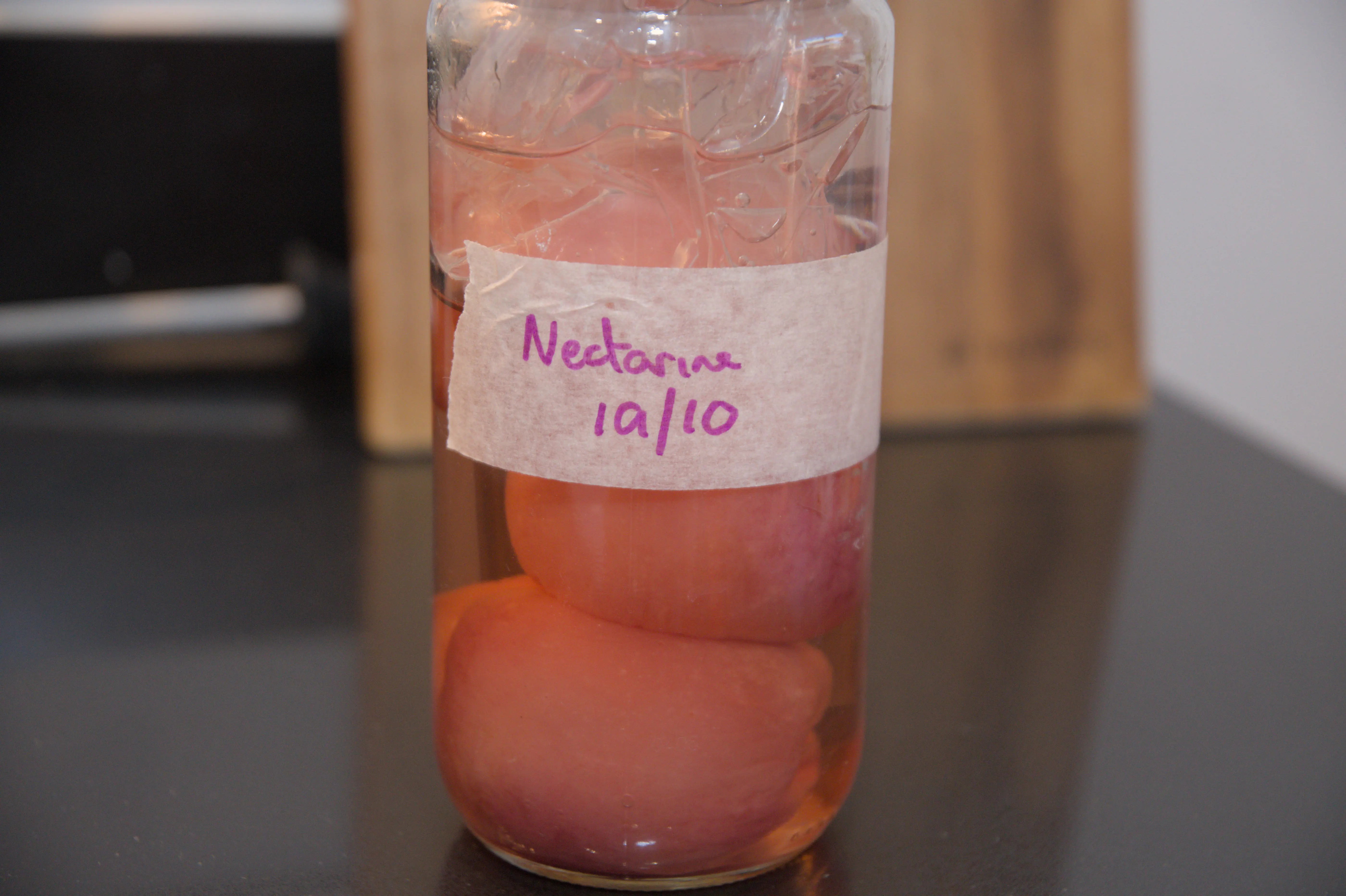 Nectarines submerged in their salted brine