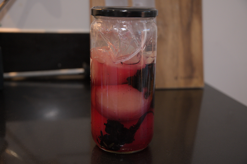 Nectarines with red shiso leaves added to the jar